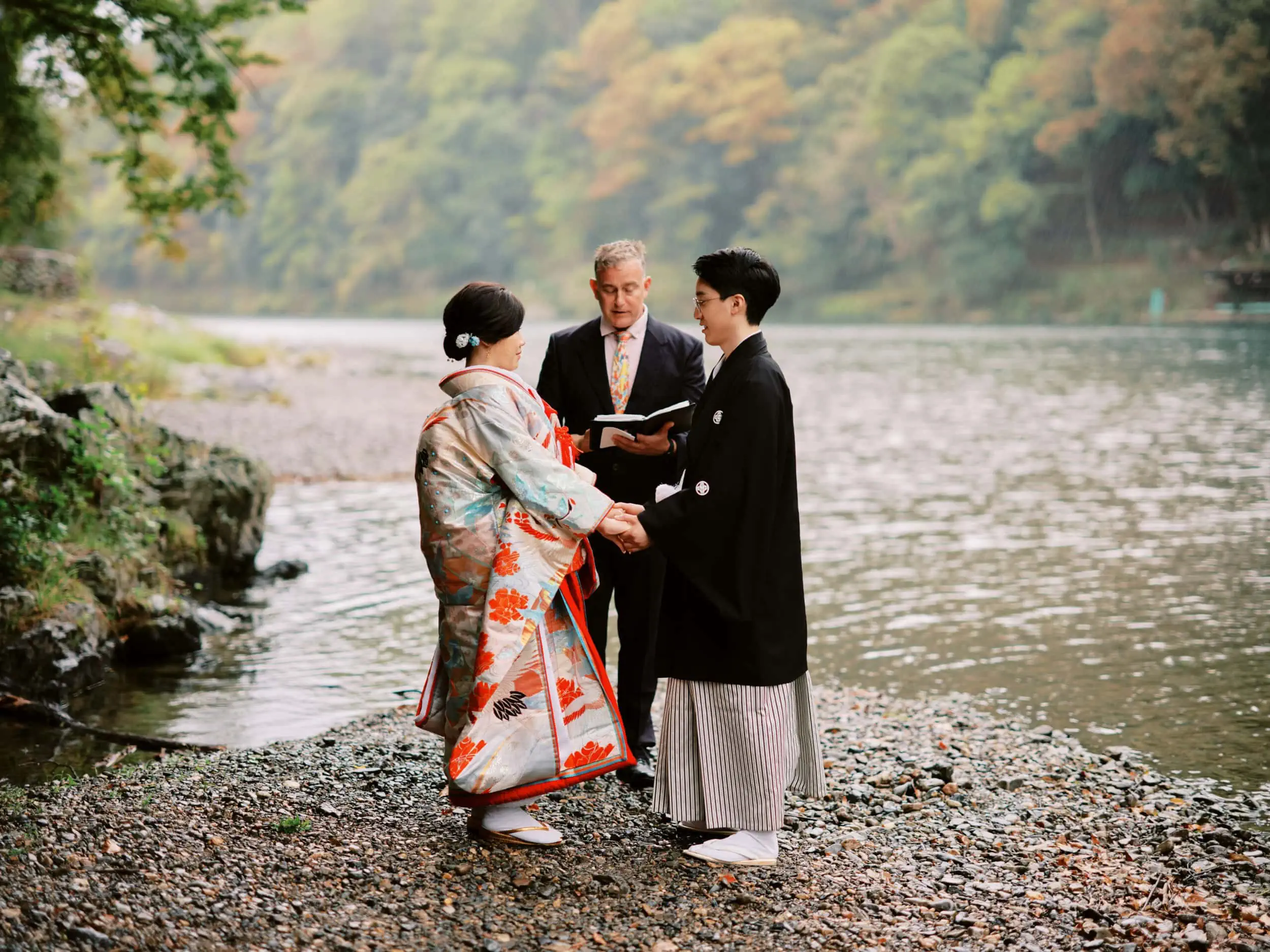 Queenstown New Zealand Elopement Wedding Photographer -         Queenstown Wedding Photographer: A man and woman in kimono standing next to a river captured by James.