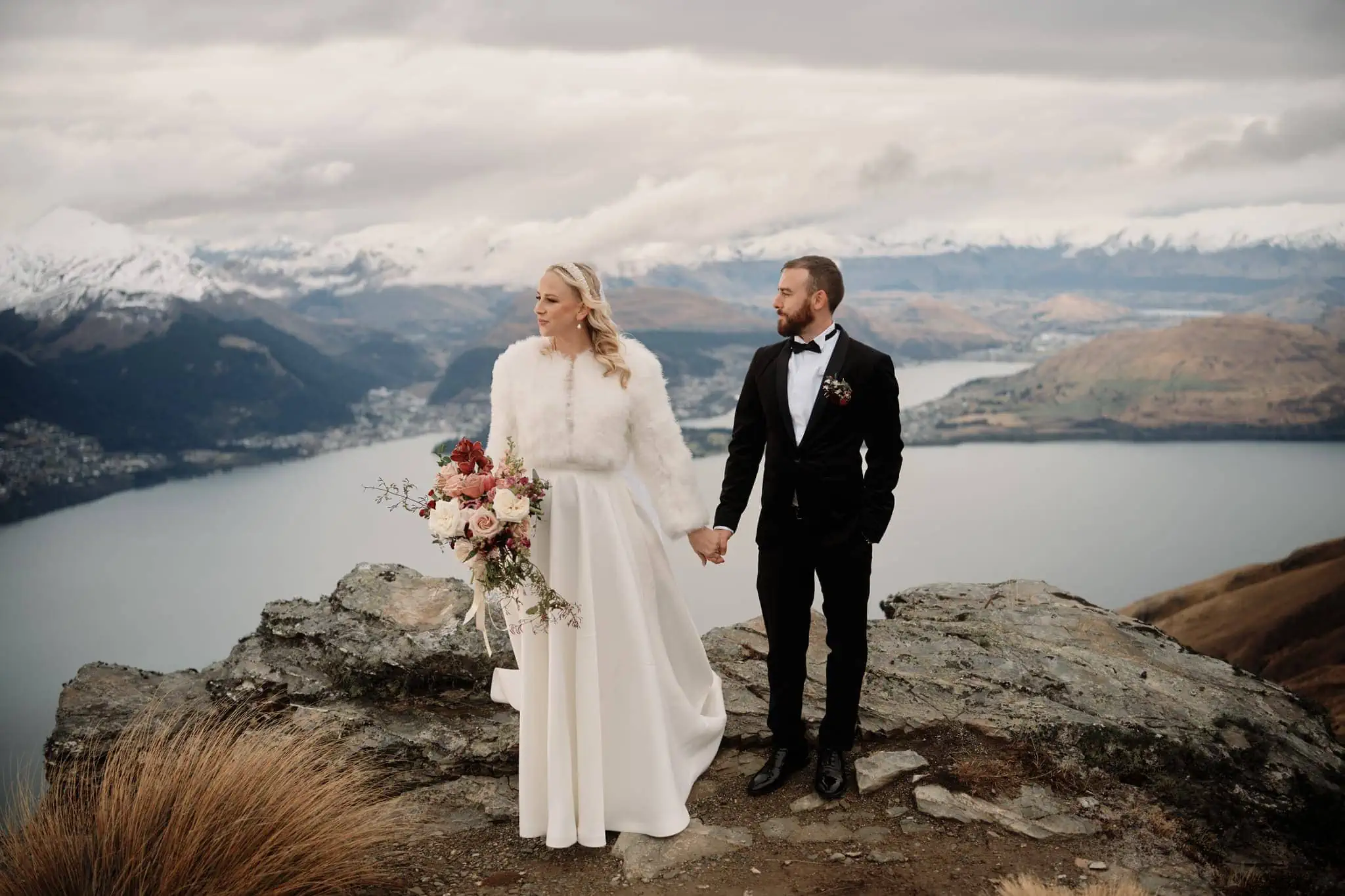 Queenstown New Zealand Elopement Wedding Photographer - Bride and groom standing on top of Cecil Peak overlooking Lake Wanaka.