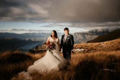 Queenstown New Zealand Elopement Wedding Photographer - A bride and groom standing on top of Cecil Peak, a magnificent mountain in New Zealand.