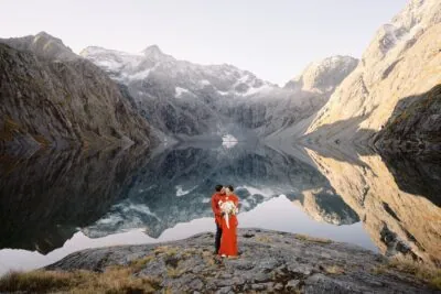 Queenstown New Zealand Elopement Wedding Photographer - Erskine bride and groom standing in front of Lake in New Zealand.