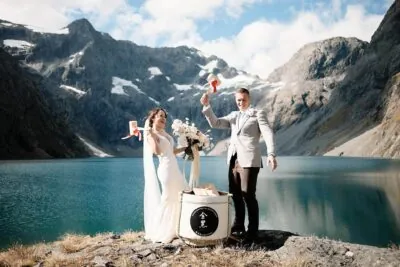 Queenstown New Zealand Elopement Wedding Photographer - A bride and groom standing in front of Lake Erskine.