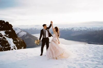 Queenstown New Zealand Elopement Wedding Photographer - A bride and groom enjoying their Remarkables wedding ceremony amidst a snow-covered mountain.