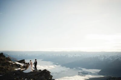 Queenstown New Zealand Elopement Wedding Photographer - A bride and groom standing on top of the Remarkables.