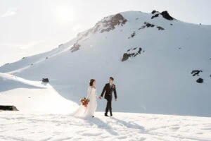 Queenstown New Zealand Elopement Wedding Photographer - A bride and groom standing on top of Tyndall Glacier.