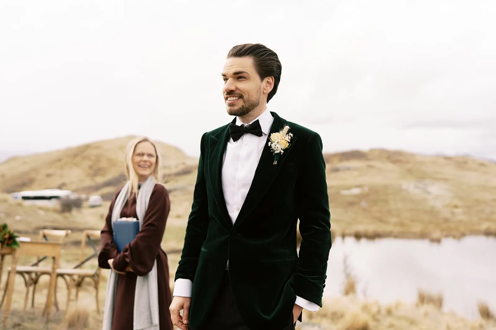 Queenstown Wedding Photographer Nat & Tim's Queenstown Elopement Wedding at Deer Park Heights, featuring a man in a green tuxedo and a woman in a green dress.
