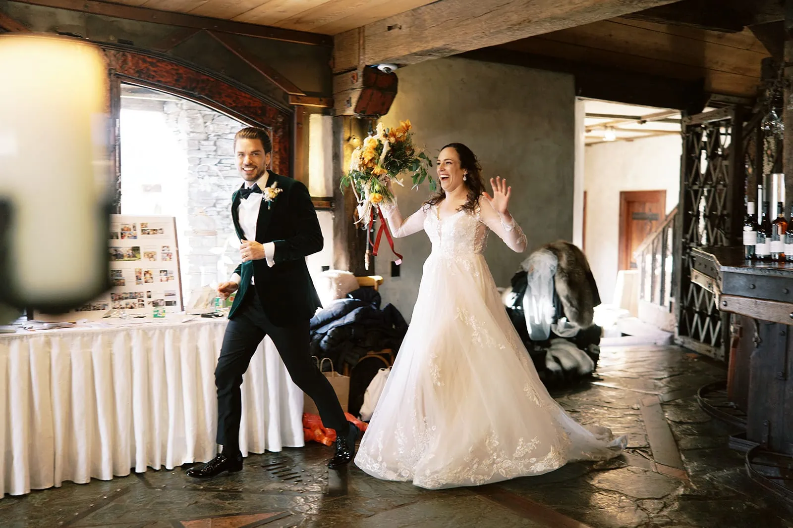 Queenstown Wedding Photographer Nat & Tim, a bride and groom, gracefully traverse through an enchanting room during their Queenstown elopement wedding at Deer Park Heights.