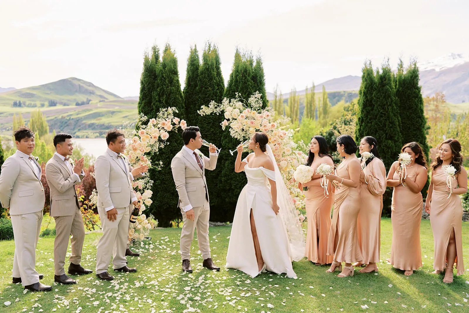 Queenstown Elopement Heli Wedding Photographer クイーンズタウン結婚式 | A group of bridesmaids and groomsmen at a wedding ceremony in Queenstown, New Zealand.