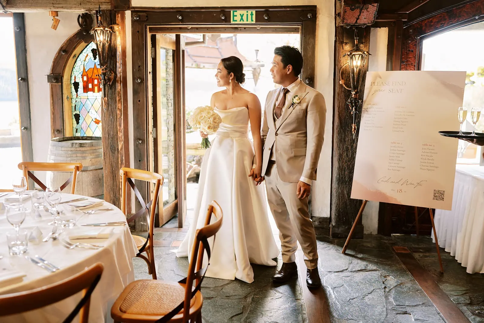 Queenstown Elopement Heli Wedding Photographer クイーンズタウン結婚式 | Tobi, the groom, and Queenstown Wedding bride standing in front of a table in a restaurant.