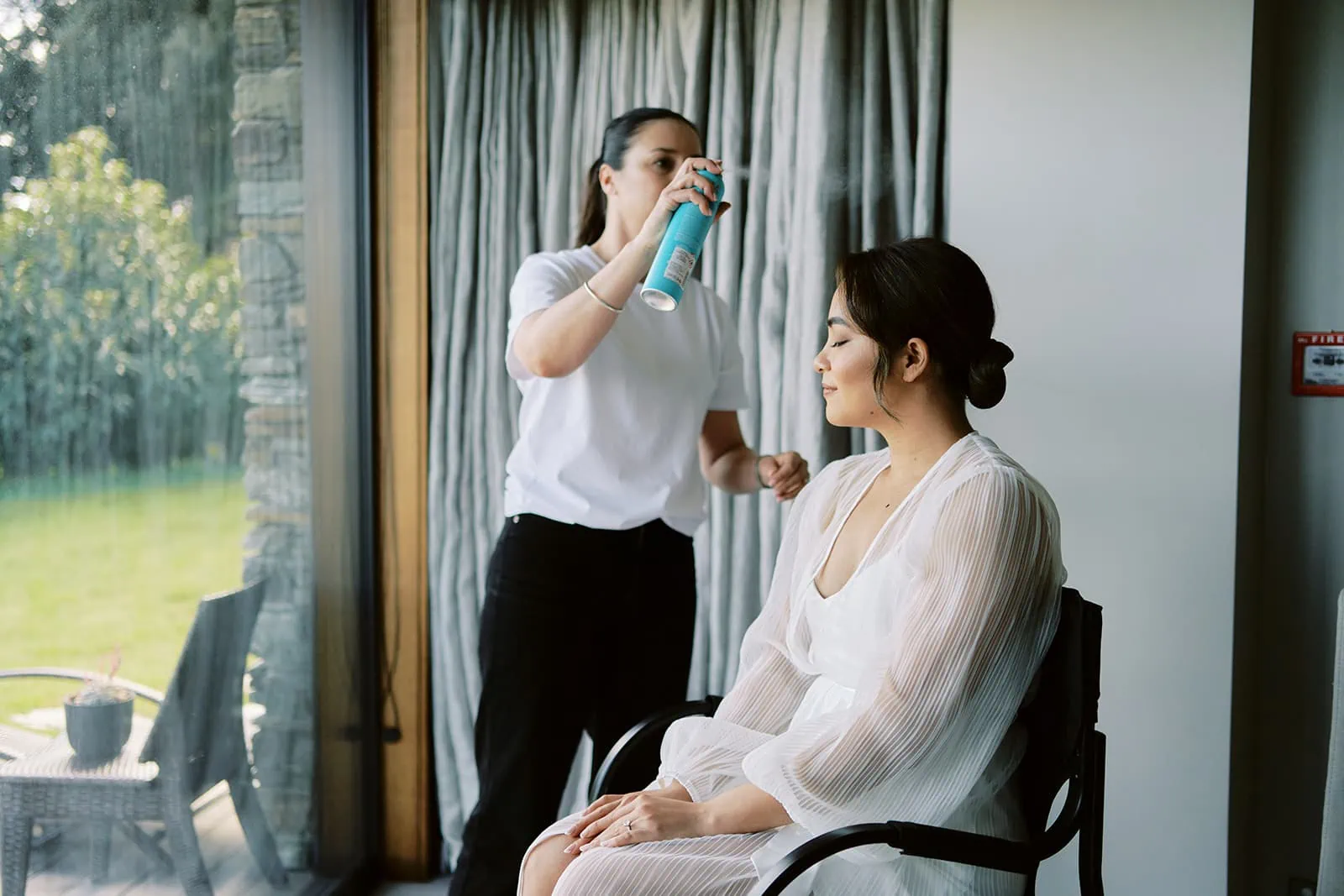 Queenstown Elopement Heli Wedding Photographer クイーンズタウン結婚式 | A woman in Queenstown getting her hair done by a hairdresser named Ceidi.