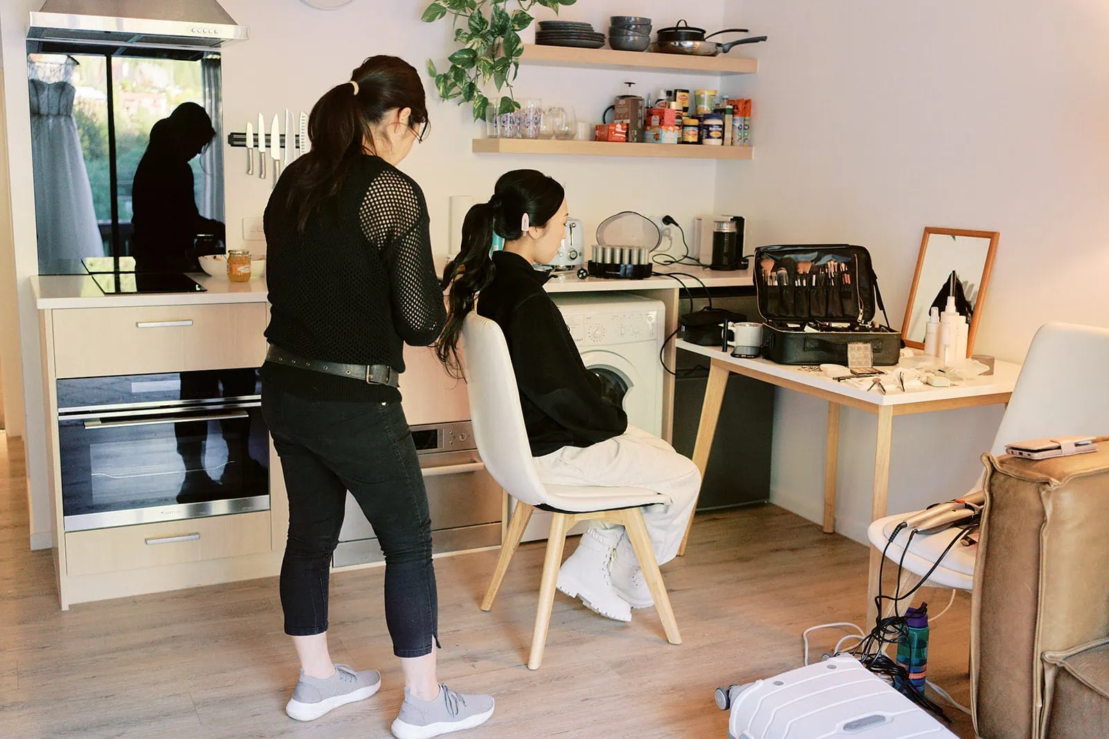 Queenstown Elopement Heli Wedding Photographer クイーンズタウン結婚式 | A woman is getting her hair done in preparation for a Heli Pre-Wedding photoshoot.
