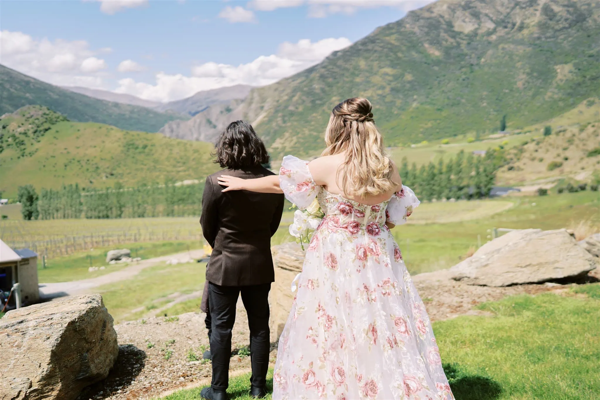 Queenstown Elopement Heli Wedding Photographer クイーンズタウン結婚式 | A couple embracing during their Coronet Peak elopement, with a breathtaking mountainous backdrop.