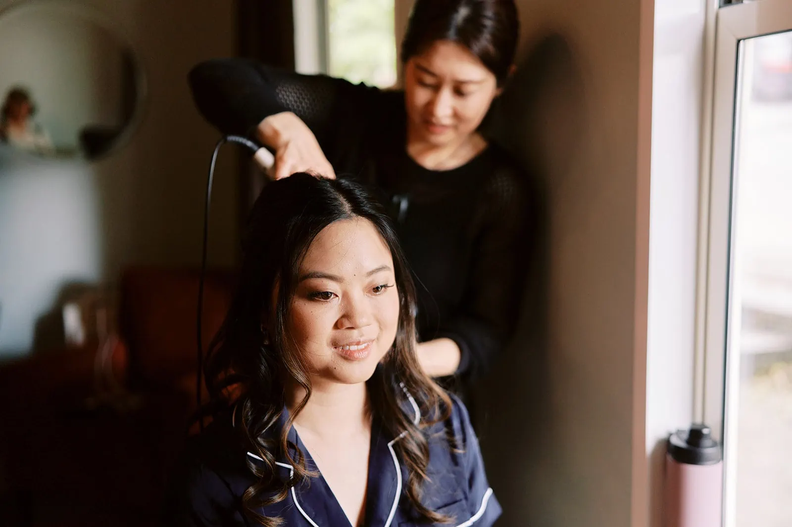 Queenstown Elopement Heli Wedding Photographer クイーンズタウン結婚式 | A woman getting her hair done for her pre-wedding photoshoot.