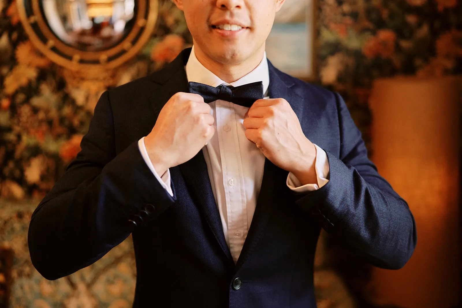 Queenstown Elopement Heli Wedding Photographer クイーンズタウン結婚式 | A dapper gentleman in a suit and bow tie poses elegantly for his pre-wedding photoshoot.
