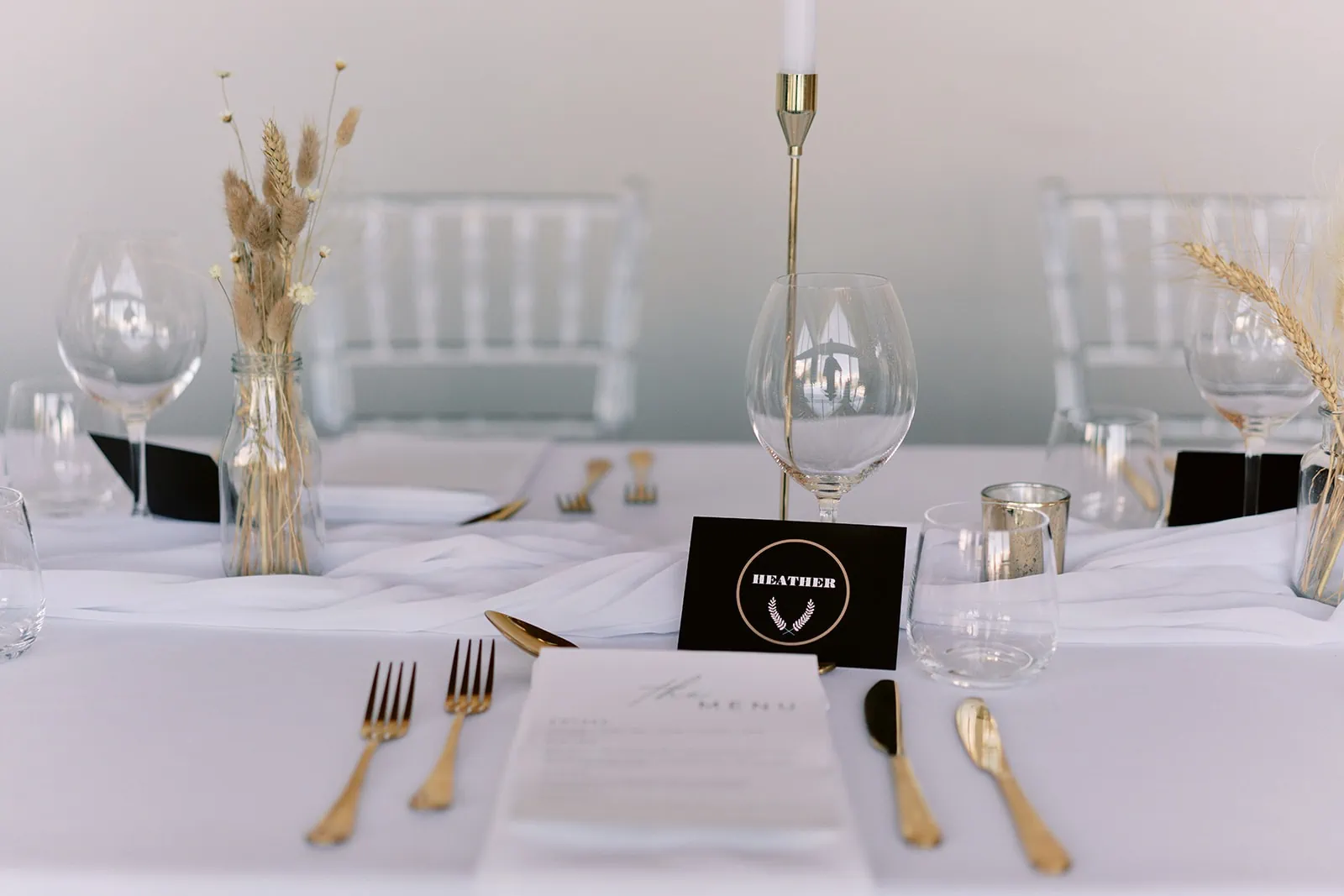 Queenstown Elopement Heli Wedding Photographer クイーンズタウン結婚式 | A table setting at the Kamana Lakehouse with gold and white plates and silverware.