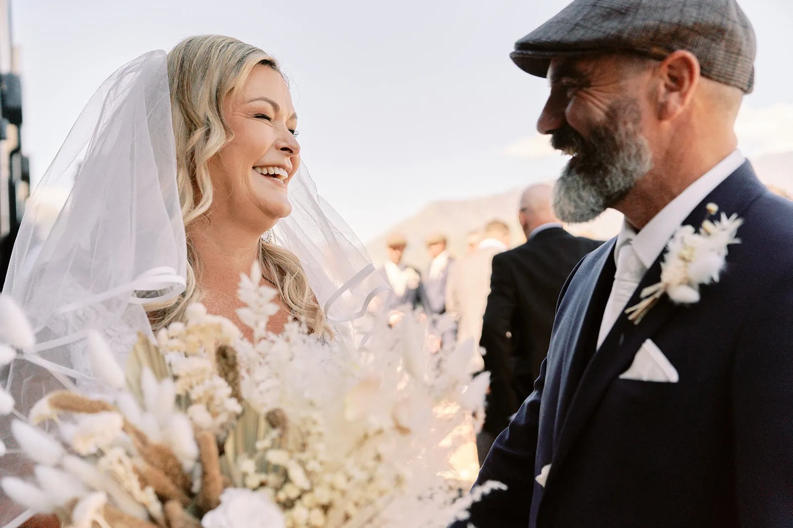 Queenstown Elopement Heli Wedding Photographer クイーンズタウン結婚式 | Melissa and Scott, a bride and groom, smiling at each other in Queenstown at the Kamana Lakehouse.
