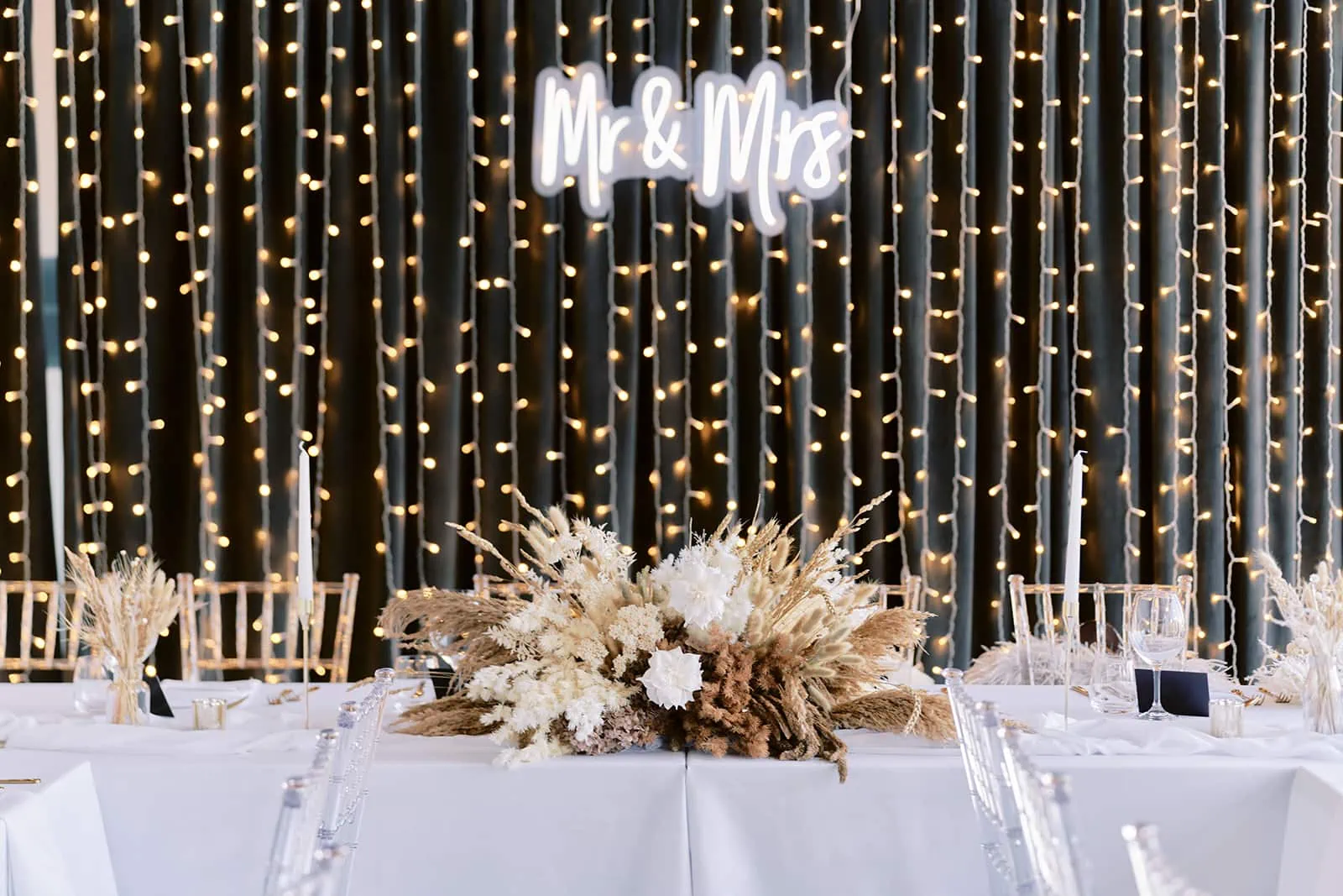 Queenstown Elopement Heli Wedding Photographer クイーンズタウン結婚式 | Melissa and Scott's wedding reception at Kamana Lakehouse with white tablecloths and string lights.