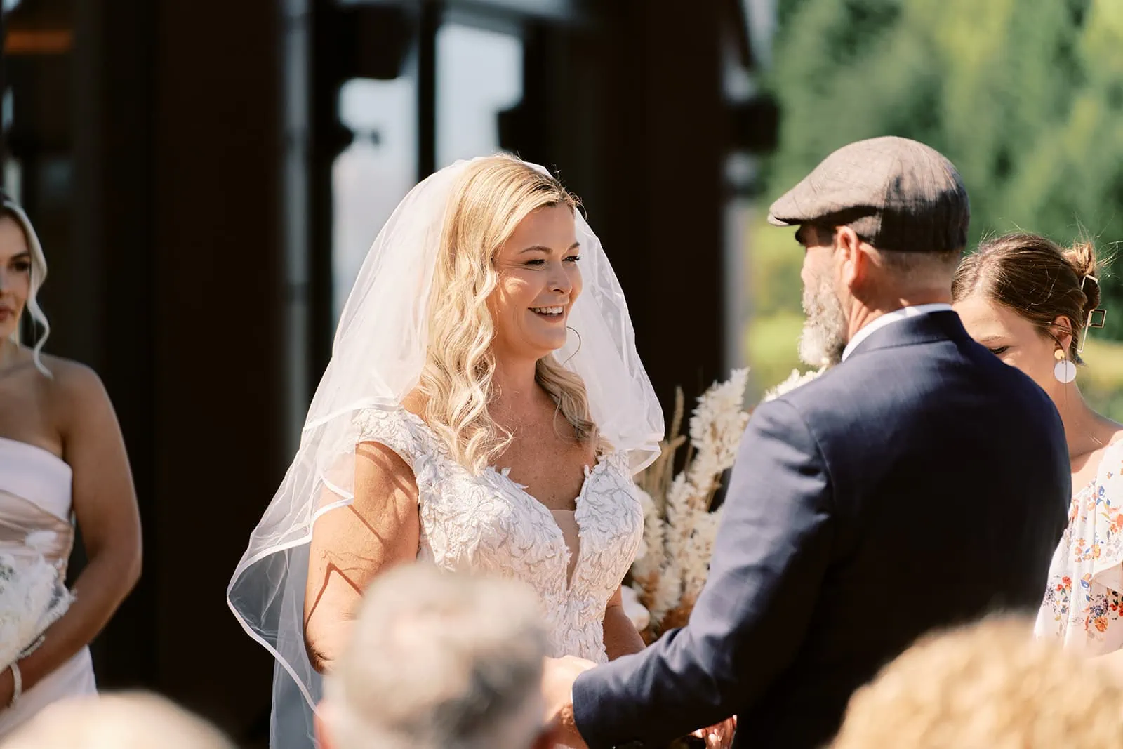 Queenstown Elopement Heli Wedding Photographer クイーンズタウン結婚式 | Melissa & Scott, a bride and groom at Kamana Lakehouse in Queenstown, smiling at each other during their wedding ceremony.