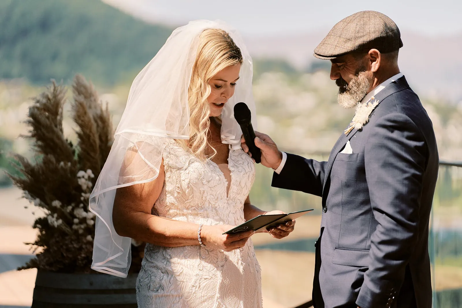 Queenstown Elopement Heli Wedding Photographer クイーンズタウン結婚式 | A bride named Melissa and groom named Scott reading their wedding vows at Kamana Lakehouse.
