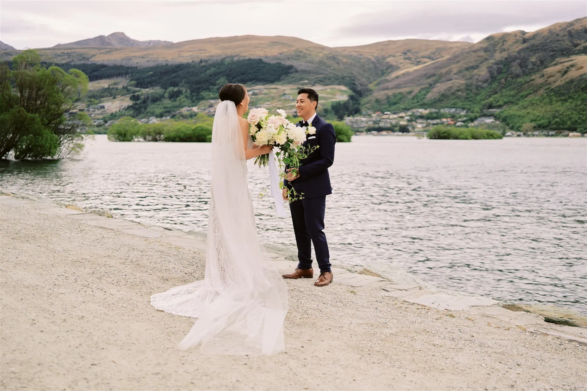 Queenstown Elopement Heli Wedding Photographer クイーンズタウン結婚式 | Cliff and Mariah's Queenstown Elopement, an epic journey of love on a beach with flowers.
