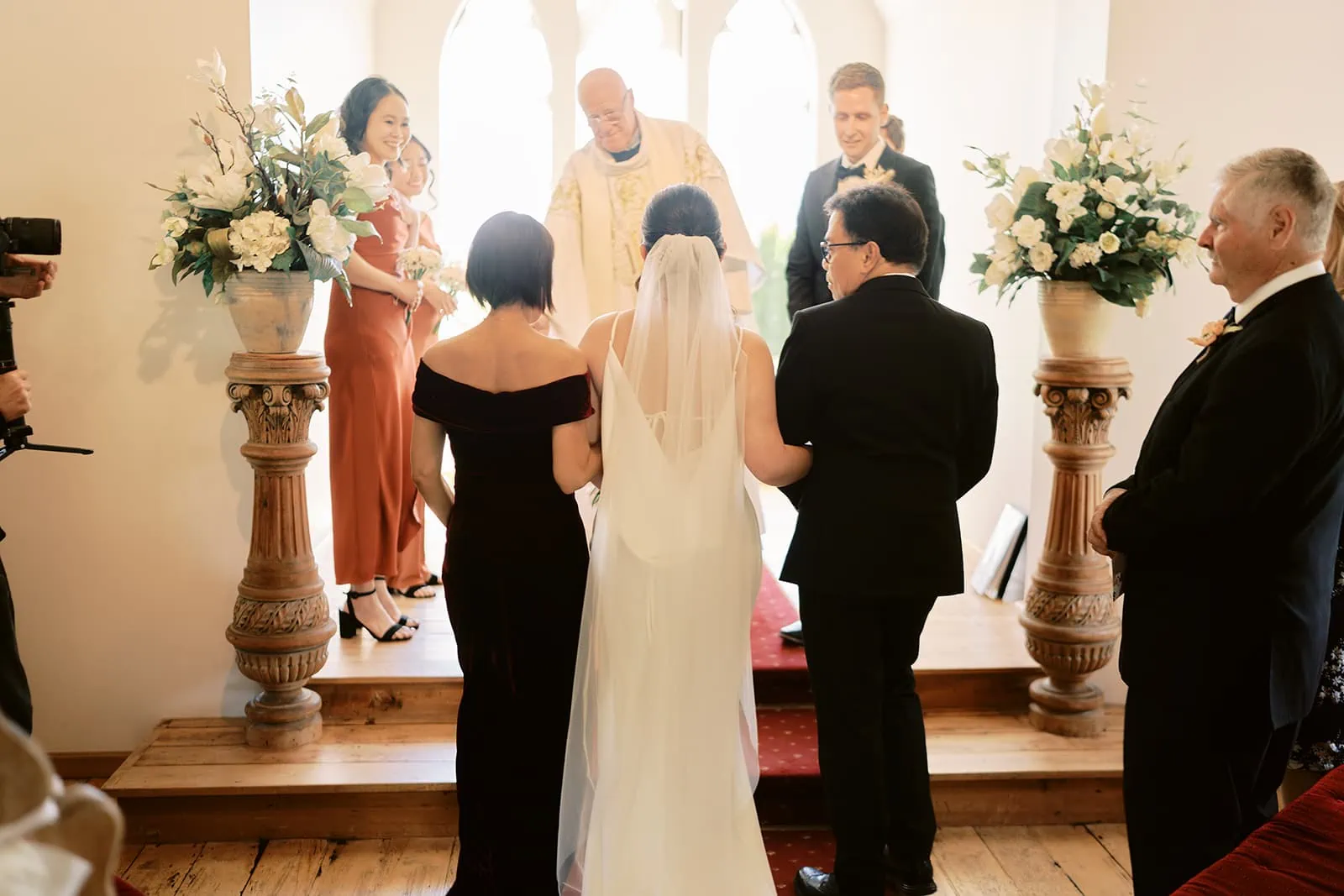 Queenstown Elopement Heli Wedding Photographer クイーンズタウン結婚式 | The wedding ceremony of Mj & Shane at Stoneridge Queenstown, with a bride and groom in a church setting.