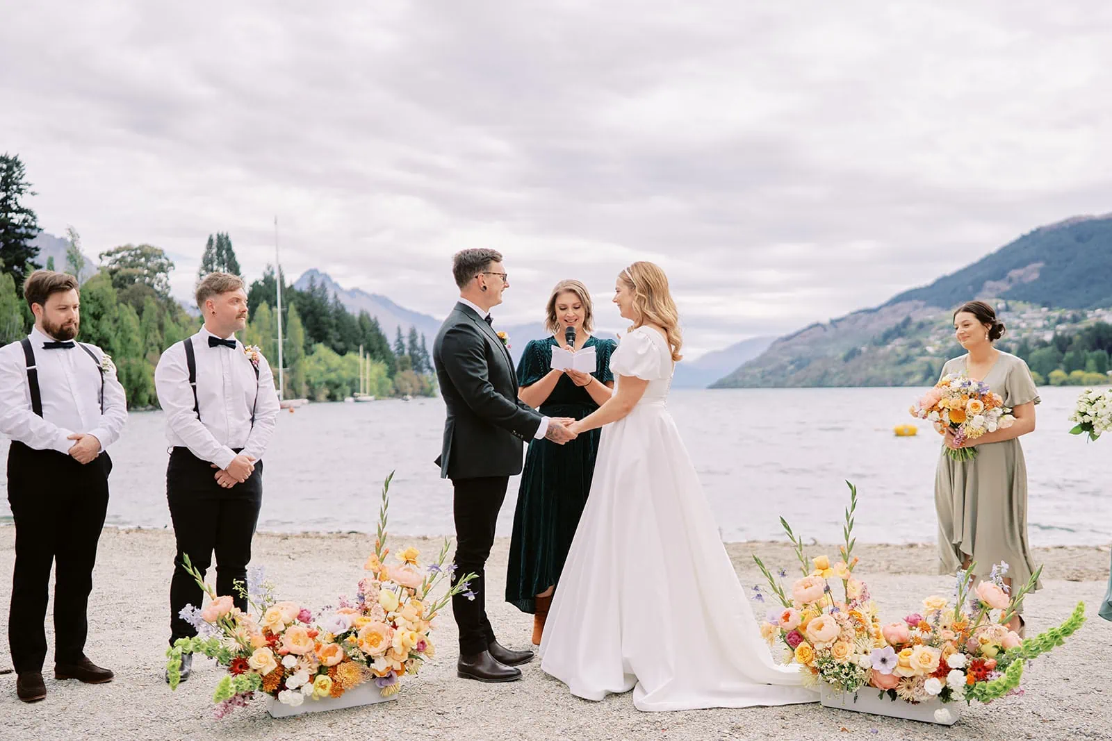 Queenstown Elopement Heli Wedding Photographer クイーンズタウン結婚式 | A couple's love story unfolds as they exchange vows in a picturesque Queenstown elopement by the lake.